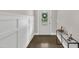 Welcoming entryway showcases modern wainscoting and seamlessly leads into the home at 706 Fireball Ct, Knightdale, NC 27545