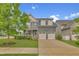 Charming two-story home showcasing a well-manicured lawn and a convenient two-car garage at 706 Fireball Ct, Knightdale, NC 27545