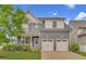 Charming two-story home featuring a well-manicured lawn and a two-car garage at 706 Fireball Ct, Knightdale, NC 27545