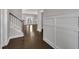 Foyer with hardwood flooring and wainscoting at 706 Fireball Ct, Knightdale, NC 27545
