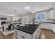 Open concept kitchen with island and view to the backyard and living room at 706 Fireball Ct, Knightdale, NC 27545