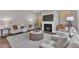 Cozy living room showcasing a fireplace, comfortable seating, and a stylish coffee table for relaxation and gathering at 706 Fireball Ct, Knightdale, NC 27545