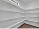 Spacious walk-in pantry with ample shelving at 706 Fireball Ct, Knightdale, NC 27545