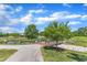 Community pond with picturesque wooden bridge, fountain, and natural landscape at 706 Fireball Ct, Knightdale, NC 27545