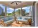 Cozy screened porch with comfortable seating and views of the landscaped yard at 706 Fireball Ct, Knightdale, NC 27545