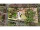 Secluded single-Gathering home featuring lush landscaping and a long driveway, offering both privacy and curb appeal at 7201 Jonathan Dr, Wendell, NC 27591
