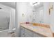 Bright bathroom featuring a vanity with a marble countertop and shower/tub with white tiling at 7201 Jonathan Dr, Wendell, NC 27591