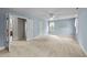 Large bedroom with two large closets, open doorway, neutral carpeting, and bright blue walls at 7201 Jonathan Dr, Wendell, NC 27591