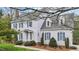 Charming two-story home with white siding, blue shutters, and a well-manicured front yard at 7201 Jonathan Dr, Wendell, NC 27591