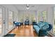 Bright sunroom with ample windows and wicker furniture, perfect for relaxation at 7201 Jonathan Dr, Wendell, NC 27591
