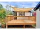 Wood deck overlooking backyard, with partial shade and access to home at 829 Colleton Rd, Raleigh, NC 27610