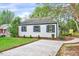 Inviting home featuring neat landscaping, a concrete driveway, and classic design elements at 829 Colleton Rd, Raleigh, NC 27610