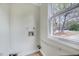 View of laundry room with convenient hookups, next to a sunlit window offering natural light at 829 Colleton Rd, Raleigh, NC 27610