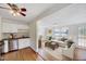 Open concept kitchen and living room featuring hardwood floors and plenty of light at 829 Colleton Rd, Raleigh, NC 27610