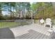 Back deck with white chairs and railing, overlooking the spacious backyard at 83 Wahoo Dr, Clayton, NC 27520
