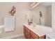 Bathroom with a white countertop, a decorative ship motif and a large mirror at 83 Wahoo Dr, Clayton, NC 27520
