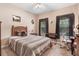 Bedroom with a cozy bed, desk, and natural light from two windows at 83 Wahoo Dr, Clayton, NC 27520