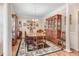 Elegant dining room featuring hardwood floors, crown molding, and a beautiful wood table at 83 Wahoo Dr, Clayton, NC 27520