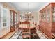 Elegant dining room featuring hardwood floors, crown molding, and a beautiful wood table at 83 Wahoo Dr, Clayton, NC 27520