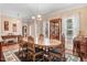 Elegant dining room featuring hardwood floors, crown molding, and a beautiful wood table at 83 Wahoo Dr, Clayton, NC 27520