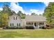 Charming home featuring a cozy front porch and well-manicured landscaping at 83 Wahoo Dr, Clayton, NC 27520