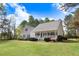 Charming home featuring a cozy front porch and well-manicured landscaping at 83 Wahoo Dr, Clayton, NC 27520