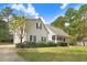 Charming home featuring a cozy front porch and well-manicured landscaping at 83 Wahoo Dr, Clayton, NC 27520