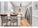 Bright kitchen with white cabinets, stainless steel appliances, and an island with seating at 83 Wahoo Dr, Clayton, NC 27520