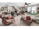 Comfortable living room with ceiling fan, a sofa and two chairs, decorated with framed pictures at 83 Wahoo Dr, Clayton, NC 27520