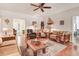 Inviting living room featuring wood floors, a ceiling fan, and a cozy seating arrangement at 83 Wahoo Dr, Clayton, NC 27520