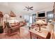 Cozy living room featuring hardwood floors, a ceiling fan, fireplace, and comfortable seating at 83 Wahoo Dr, Clayton, NC 27520