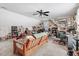 Eclectic living room with wood futon, many pictures and art, and a desk with computer at 83 Wahoo Dr, Clayton, NC 27520