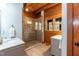 Modern bathroom with a glass-enclosed shower, stone accents, and double marble vanities at 932 Gynnis Creek Dr, Moncure, NC 27559