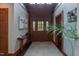 Grand foyer with a tall ceiling, wood accents, hardwood floors, and a decorative area rug at 932 Gynnis Creek Dr, Moncure, NC 27559