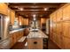 Spacious kitchen features stainless steel appliances, custom cabinets, granite countertops and center island gas range at 932 Gynnis Creek Dr, Moncure, NC 27559