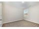 Bedroom with neutral walls and carpet, window overlooking the outdoors, and ample natural light at 104 Burnello Ct, Princeton, NC 27569