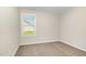Neutral-toned bedroom with carpeted floor and a window overlooking the outdoors at 104 Burnello Ct, Princeton, NC 27569