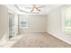 Cozy bedroom with plush carpeting, tray ceiling, and ample natural light at 104 Burnello Ct, Princeton, NC 27569