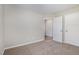 Neutral-toned bedroom with standard closet and en-suite bathroom access, carpeted floor at 104 Burnello Ct, Princeton, NC 27569