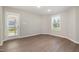 Light-filled flex room with wood-look floors and access to the outdoors at 104 Burnello Ct, Princeton, NC 27569