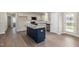 Modern kitchen with stainless steel appliances, granite countertops, and center island at 104 Burnello Ct, Princeton, NC 27569