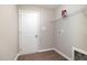 Laundry room featuring vinyl flooring, a wire shelf, and a washing machine hookup at 104 Burnello Ct, Princeton, NC 27569
