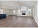 Spacious living room with wood floors, fireplace, and vaulted ceilings at 104 Burnello Ct, Princeton, NC 27569
