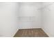 Walk-in closet providing efficient storage with carpeted floor and wire shelving system at 104 Burnello Ct, Princeton, NC 27569