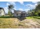 View of a home with screened in porch and spacious yard, great for outdoor living and entertainment at 104 Roma Gora Ct, Princeton, NC 27569