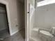 Bathroom view showcasing a white shower-tub and white toilet at 104 Roma Gora Ct, Princeton, NC 27569
