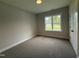 Cozy bedroom with a view, carpet floors and plenty of natural light at 104 Roma Gora Ct, Princeton, NC 27569