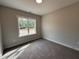 Neutral bedroom with a large window and ample space at 104 Roma Gora Ct, Princeton, NC 27569