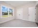 Bright bedroom features carpet, natural light from windows and trim, and a double closet at 104 Roma Gora Ct, Princeton, NC 27569