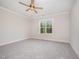 Bedroom with neutral carpet, ceiling fan and natural light at 104 Roma Gora Ct, Princeton, NC 27569
